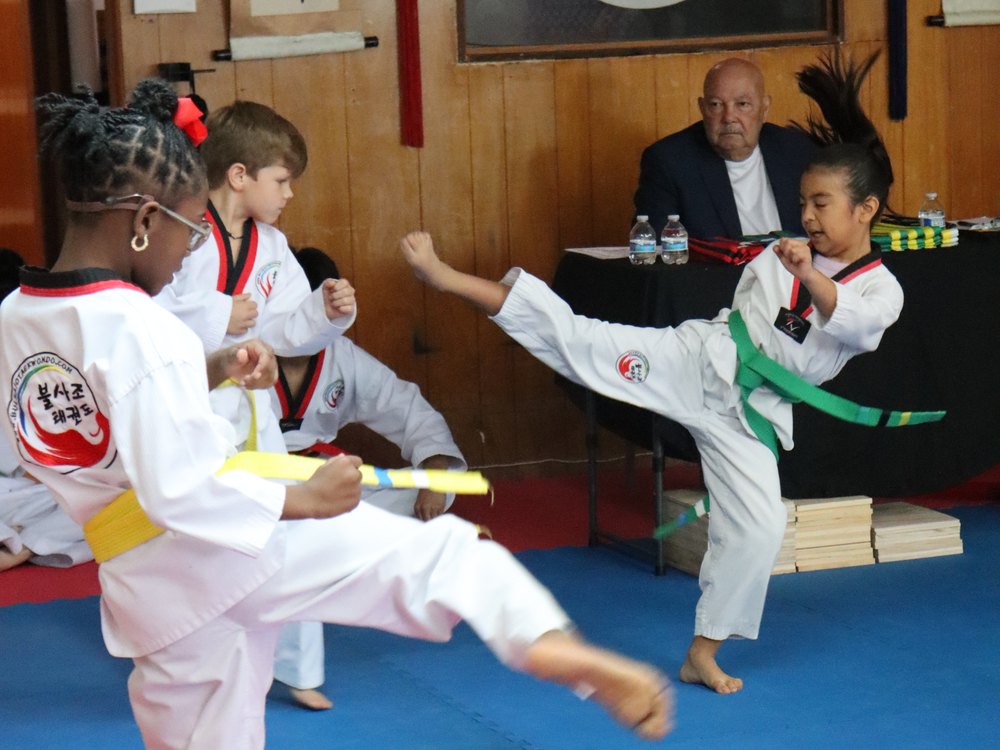 A student throwing a kick in class