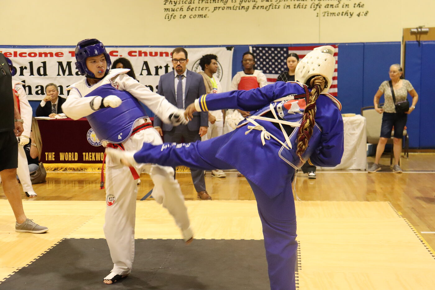 A Bulsajo student landing a high roundhouse kick in a tournament bout
